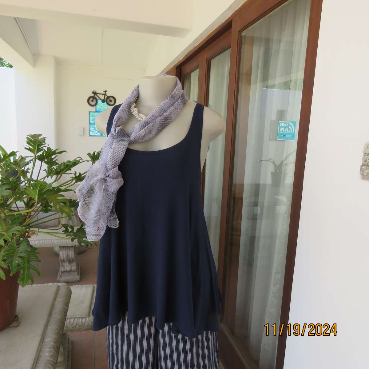 EARTH ANGEL navy blue extra wide cut sleeveless top with scooped neckline.Size 38.In stretch viscose