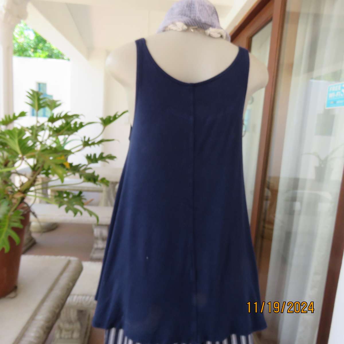 EARTH ANGEL navy blue extra wide cut sleeveless top with scooped neckline.Size 38.In stretch viscose
