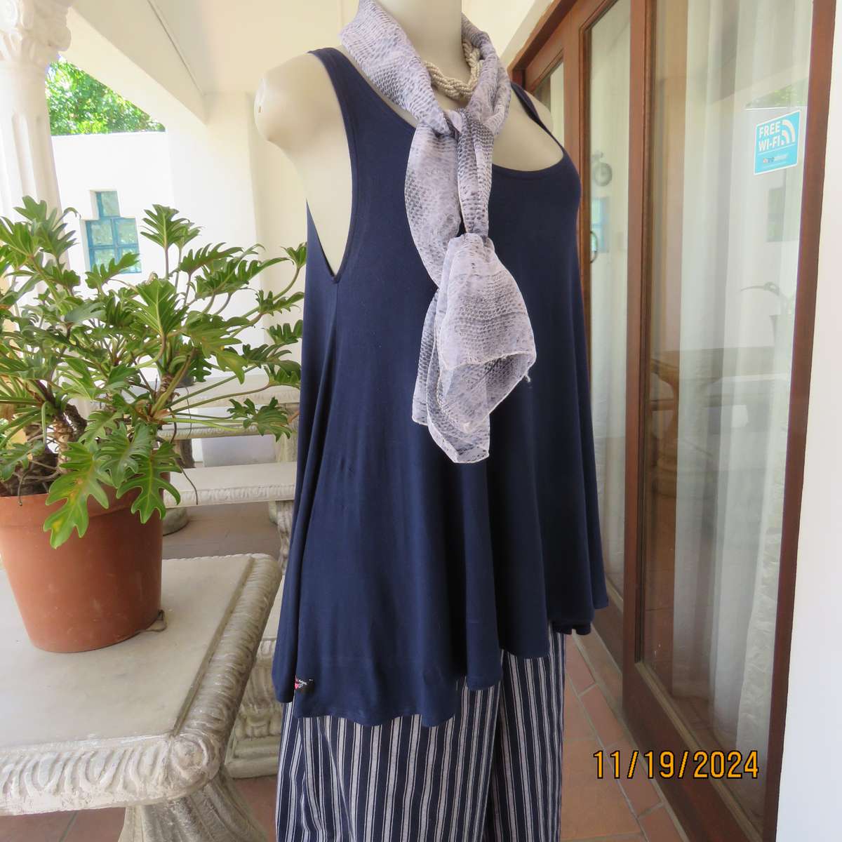 EARTH ANGEL navy blue extra wide cut sleeveless top with scooped neckline.Size 38.In stretch viscose