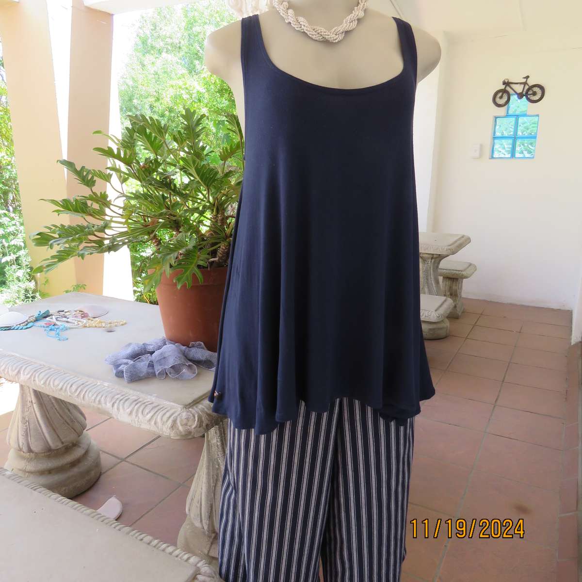 EARTH ANGEL navy blue extra wide cut sleeveless top with scooped neckline.Size 38.In stretch viscose