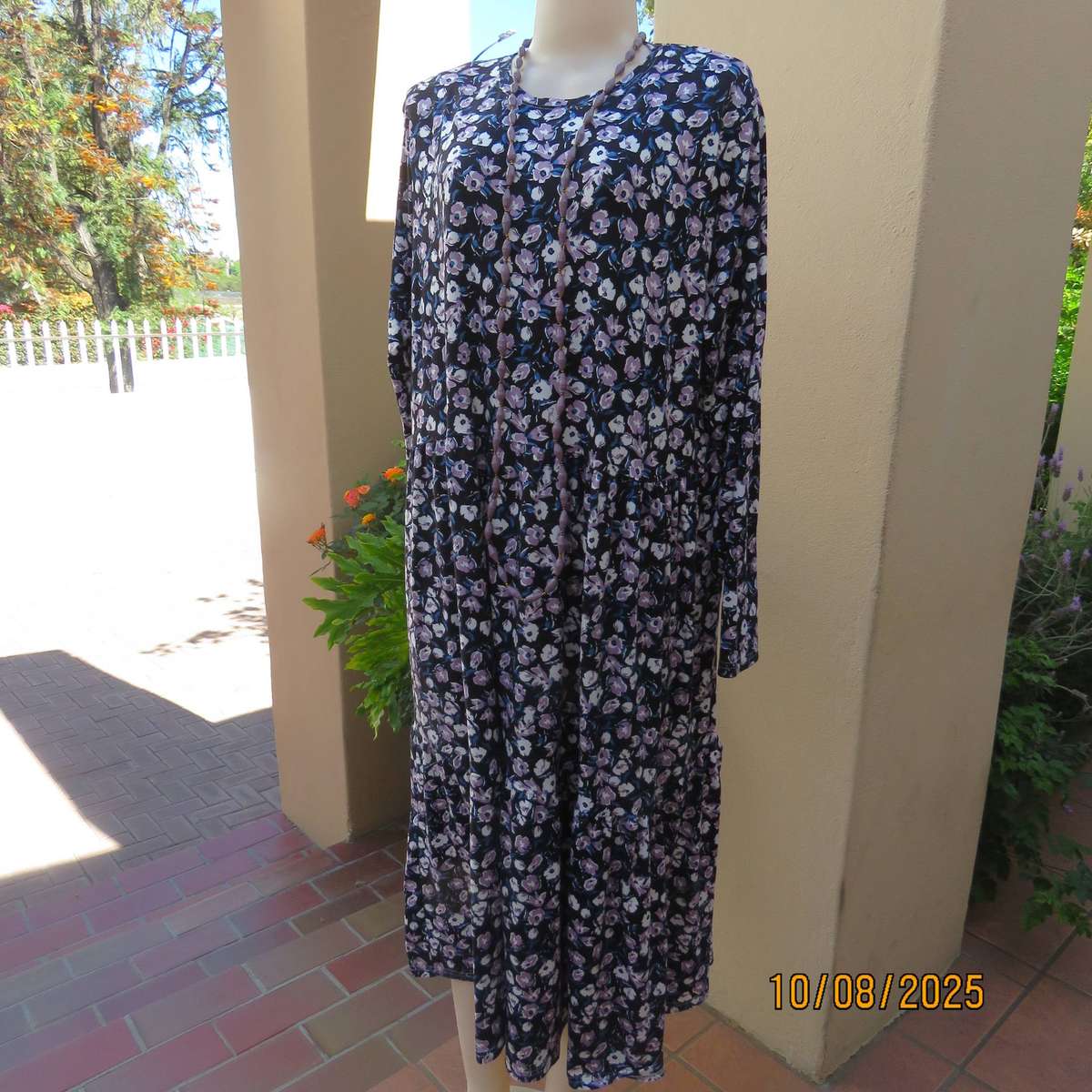 Black stretch polyester tiered slip over dress with lilac-white-blue flowers. Size 44