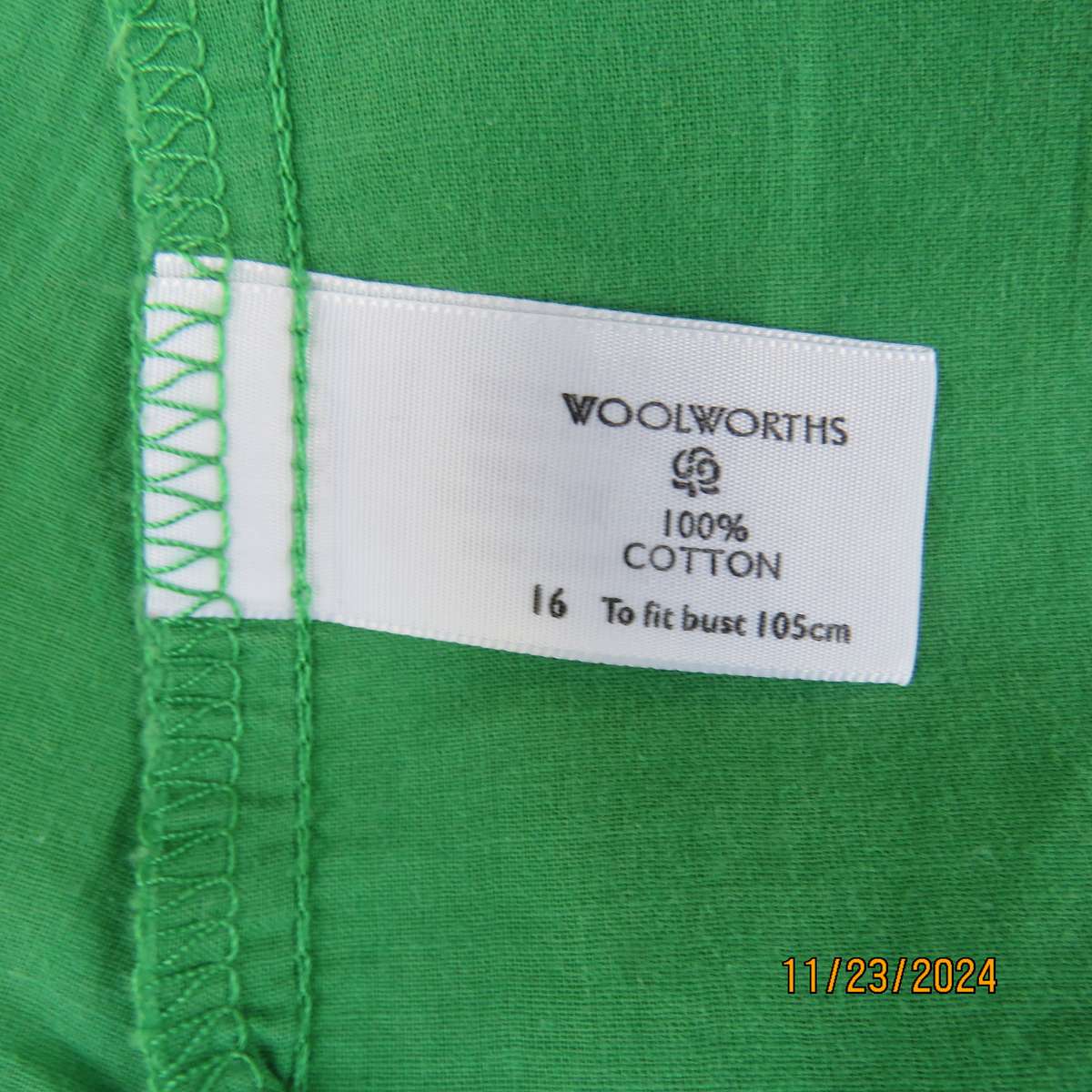 Cool green WOOLWORTHS capped sleeve top. Close with press buttons on front.Size 40. Peter Pan collar