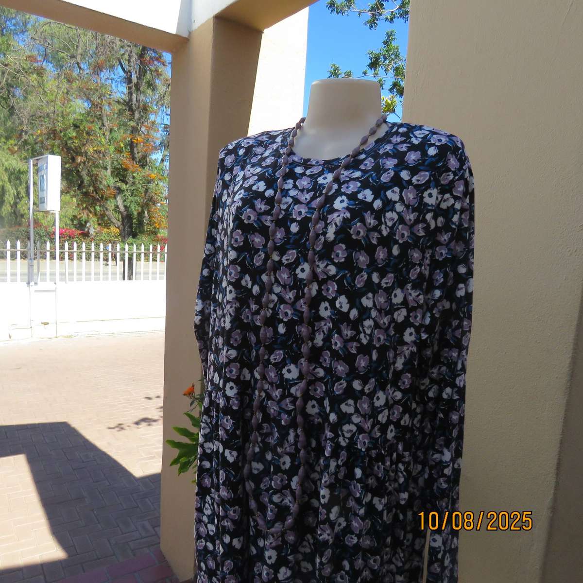 Black stretch polyester tiered slip over dress with lilac-white-blue flowers. Size 44