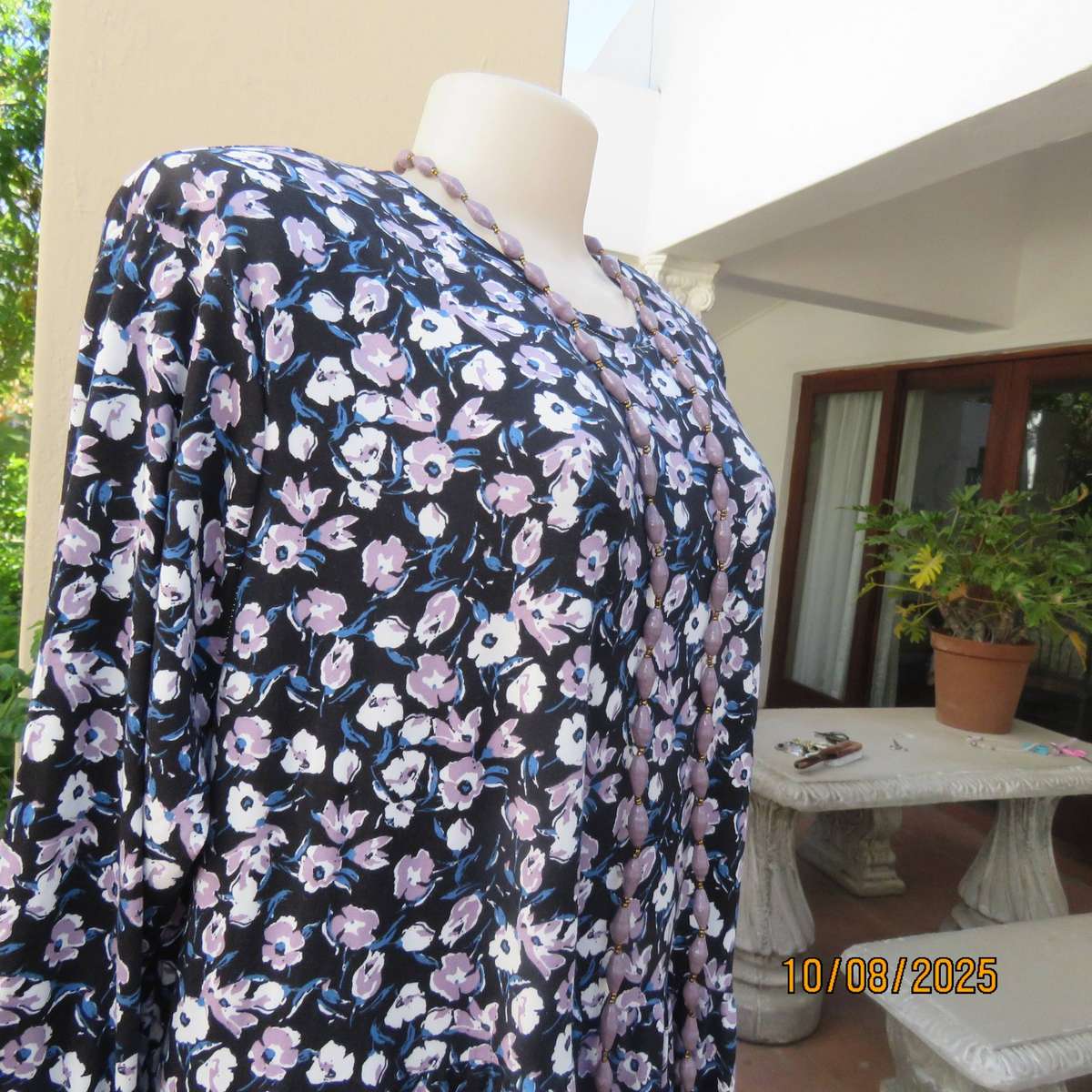 Black stretch polyester tiered slip over dress with lilac-white-blue flowers. Size 44