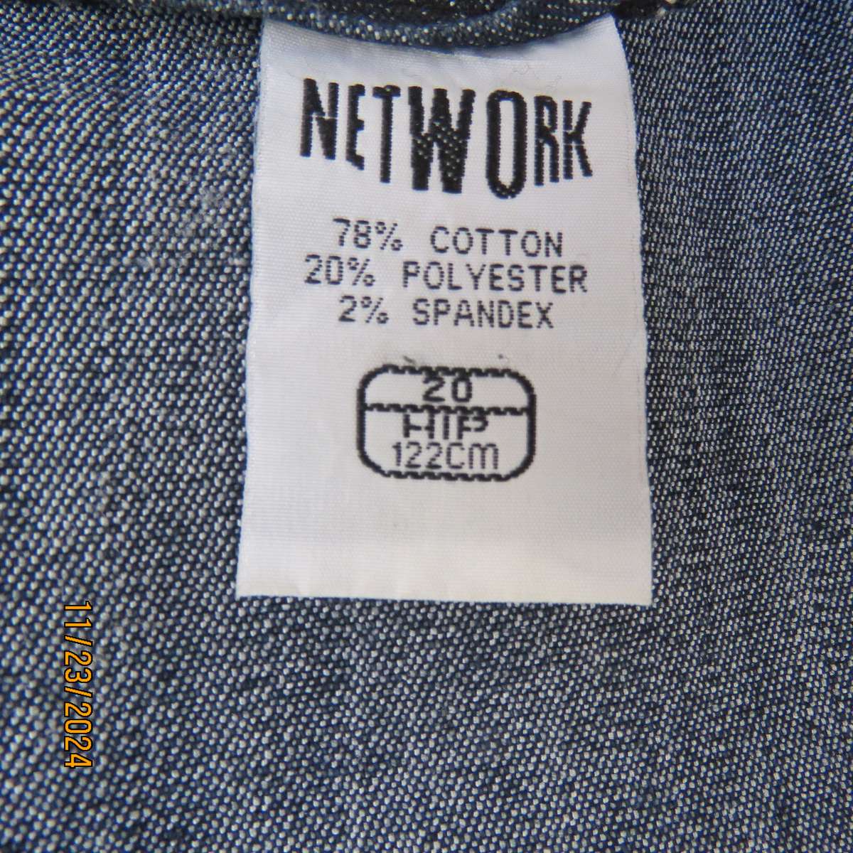 As new dark blue denim jean uniquely paneled kick-out skirt size 44. Bandless. Polycotton stretch.