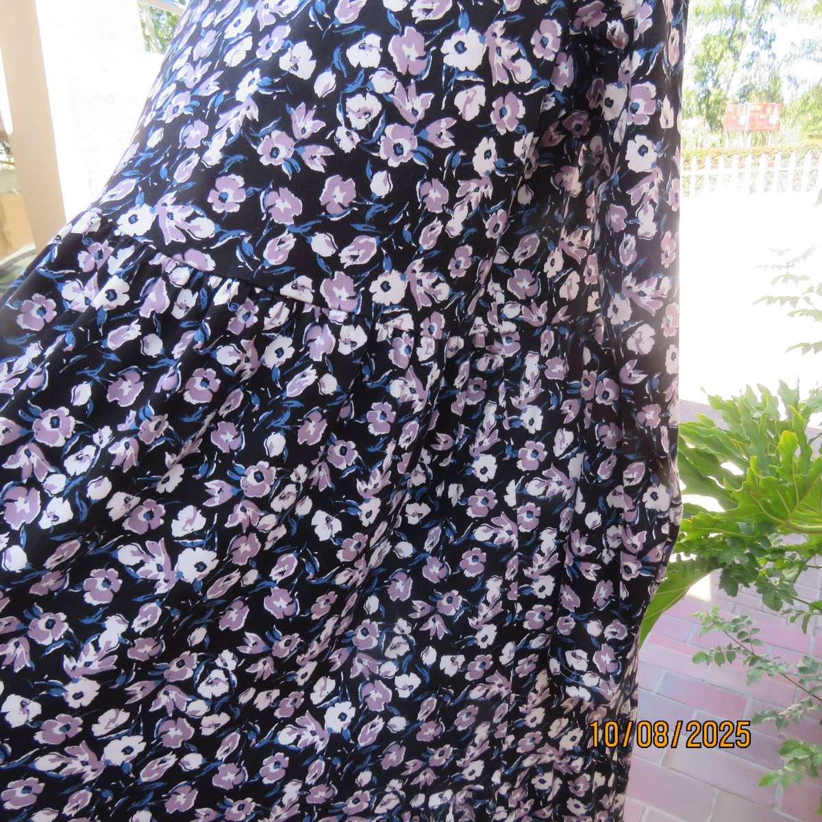 Black stretch polyester tiered slip over dress with lilac-white-blue flowers. Size 44