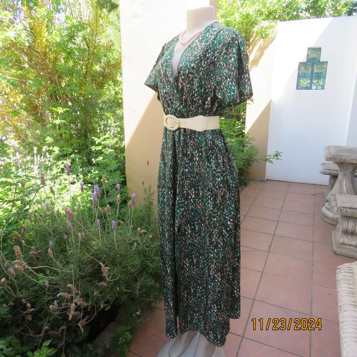Maxi boutique made colourful dress with cross over bustline and elasticated waist. Size 40. As new