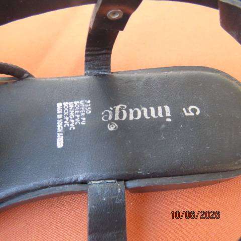 Black flat sandals with ankle strap and glam straps, size 5. Never worn.