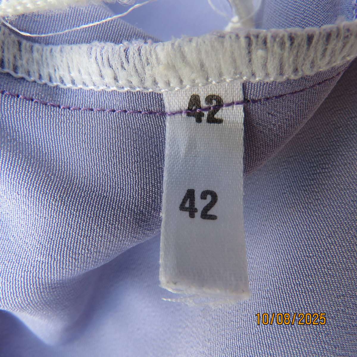 Lilac pleated polyester skirt with wide yoke and elasticated waist. Size 42