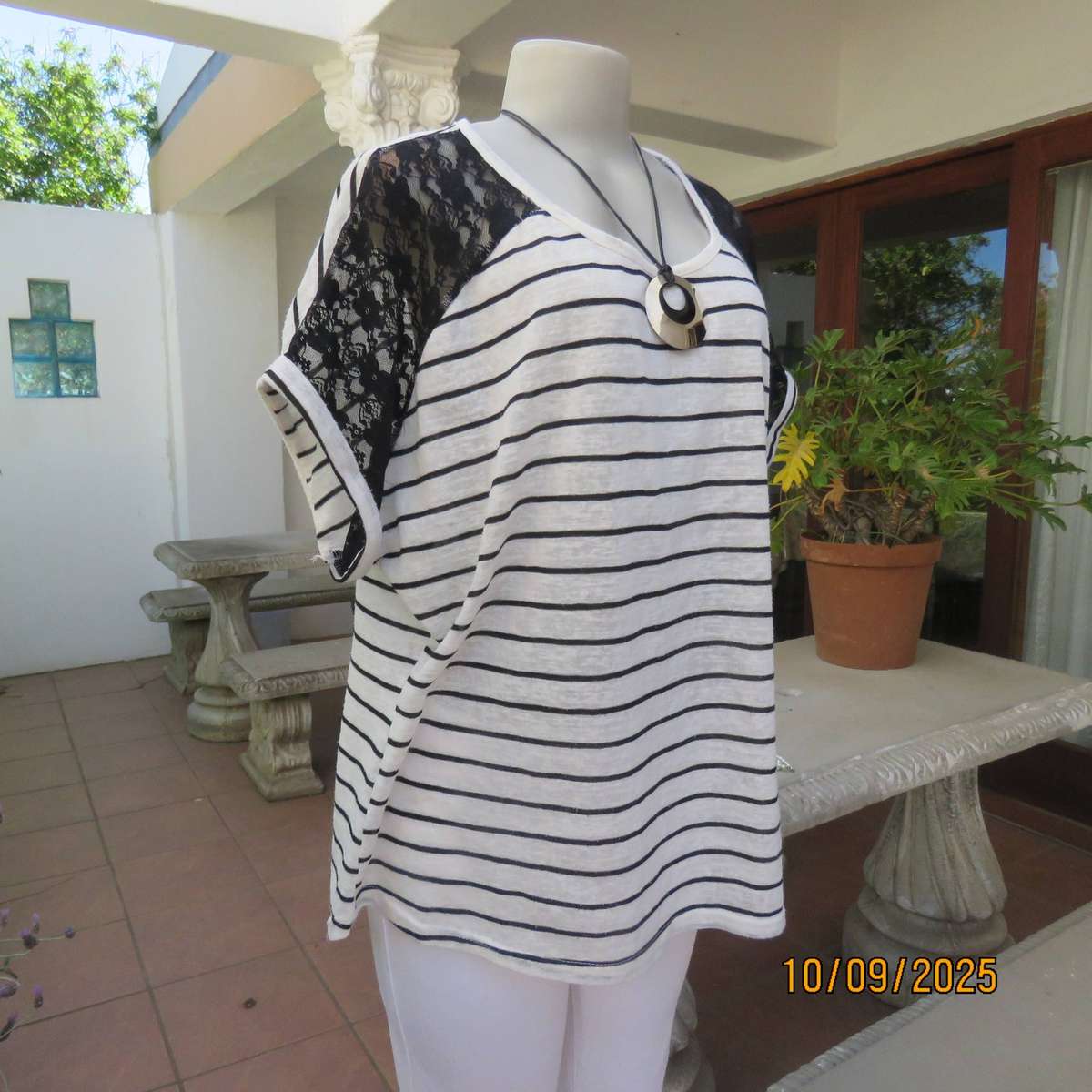 White textured stretch polycotton top with black lace shoulder front inlays. Size 44