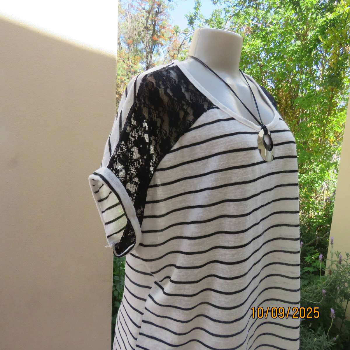 White textured stretch polycotton top with black lace shoulder front inlays. Size 44