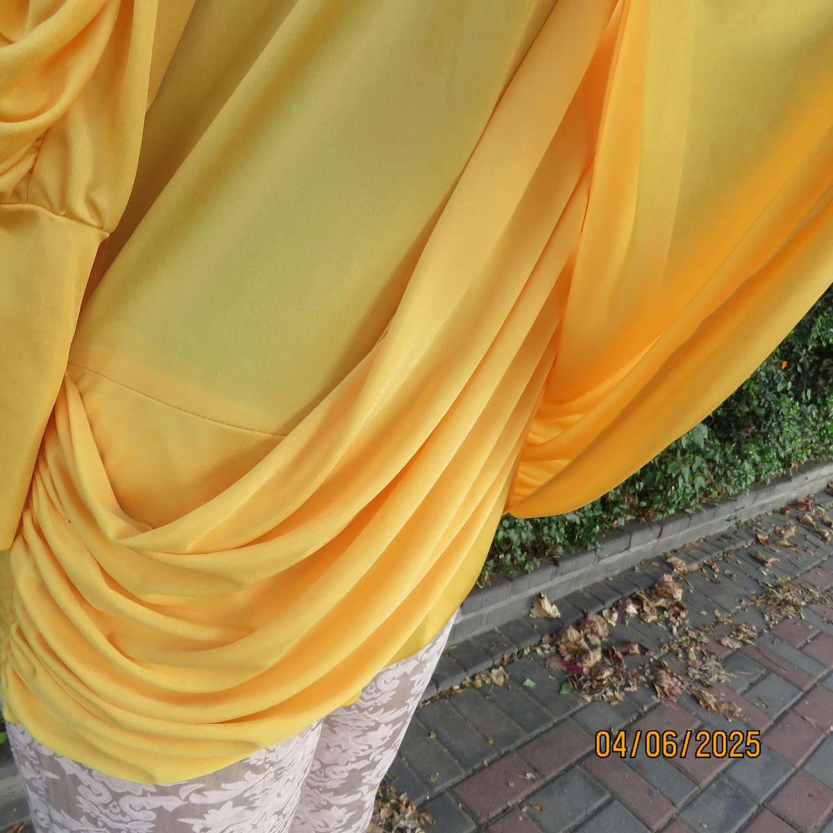 Buttercup yellow unique size 40 stretch polyester top. Crossover overlays. Shoulder decoration.