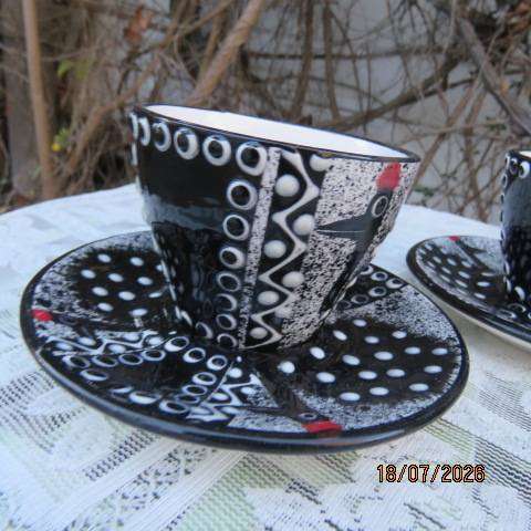 SIFISILE Pottery black hand-painted ceramic teacups and saucers with guinea fowls