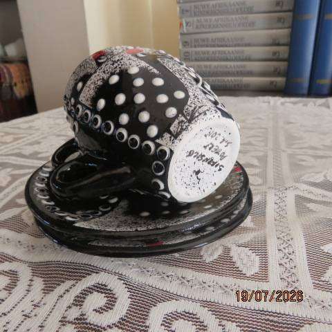 SIFISILE Pottery black hand-painted ceramic teacups and saucers with guinea fowls