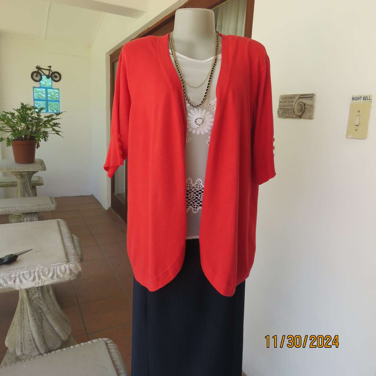 Statement red short sleeve knitted cardi in viscose stretch. Size 44-46.By RENE TAYLOR.As new