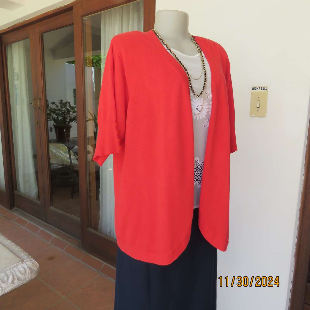 Statement red short sleeve knitted cardi in viscose stretch. Size 44-46.By RENE TAYLOR.As new