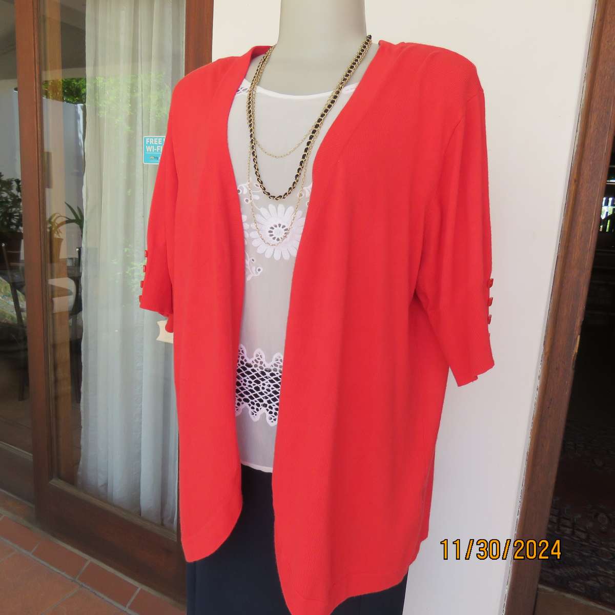 Statement red short sleeve knitted cardi in viscose stretch. Size 44-46.By RENE TAYLOR.As new