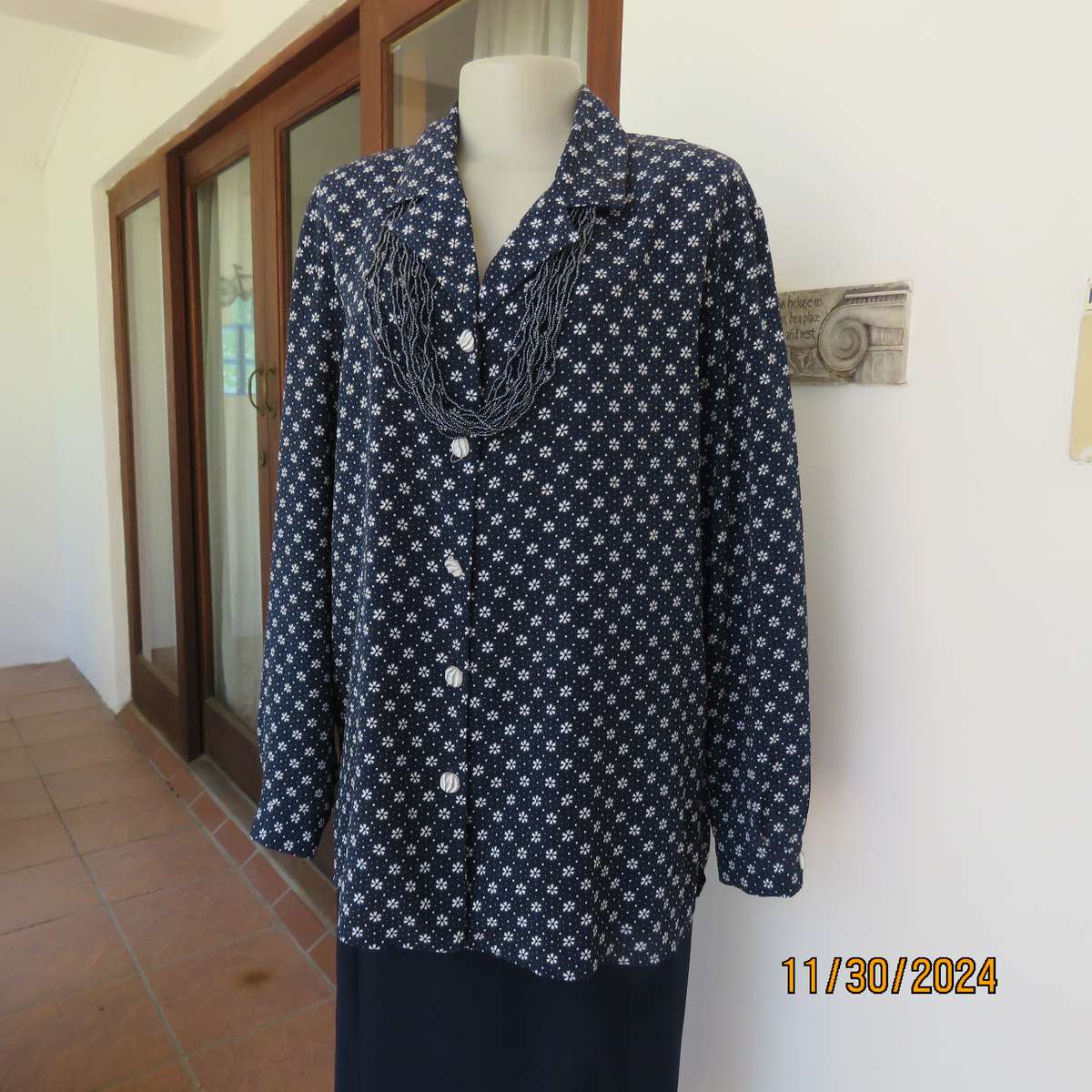 Classic navy long sleeve button down top with tiny white flowers.Size 42. Button down.As new