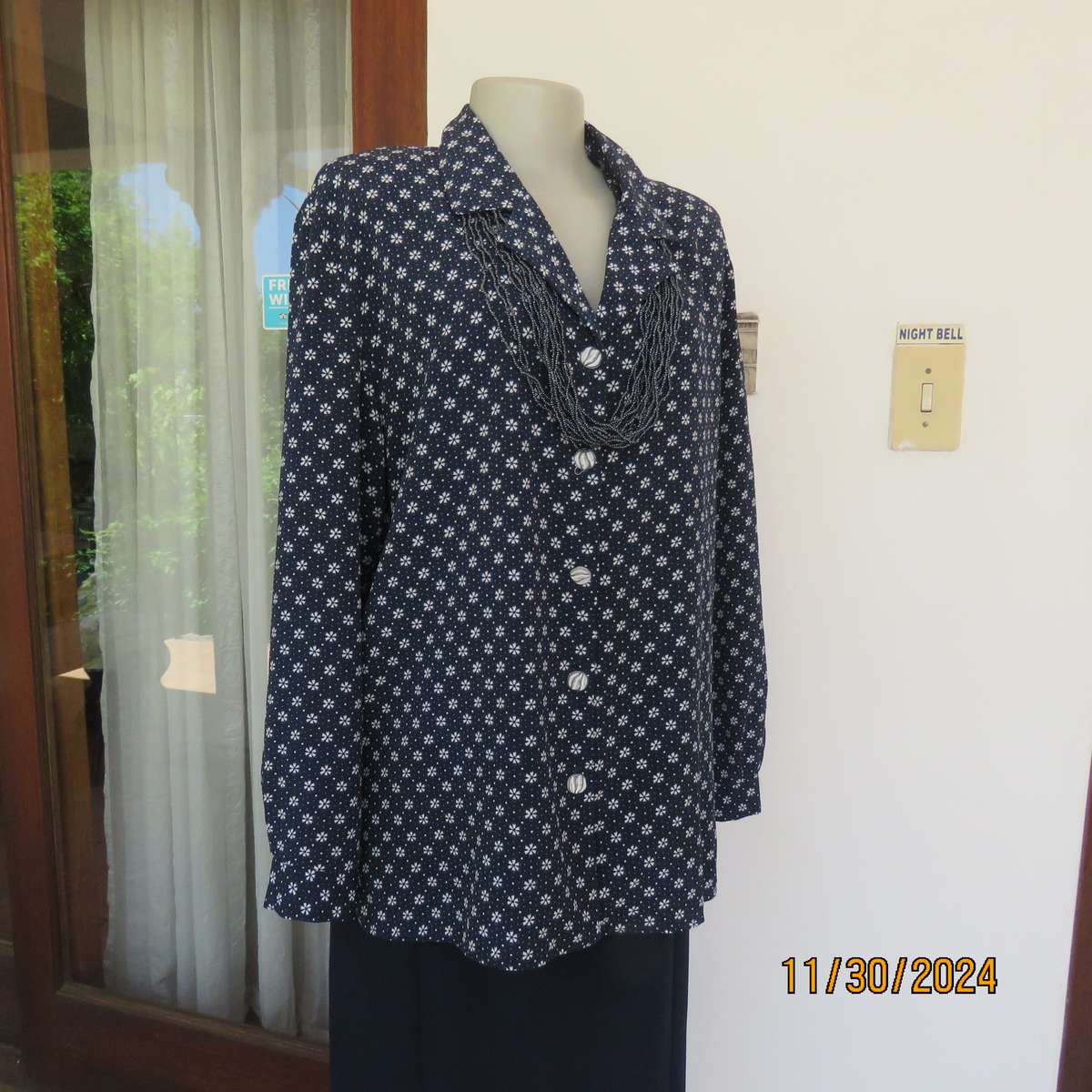 Classic navy long sleeve button down top with tiny white flowers.Size 42. Button down.As new