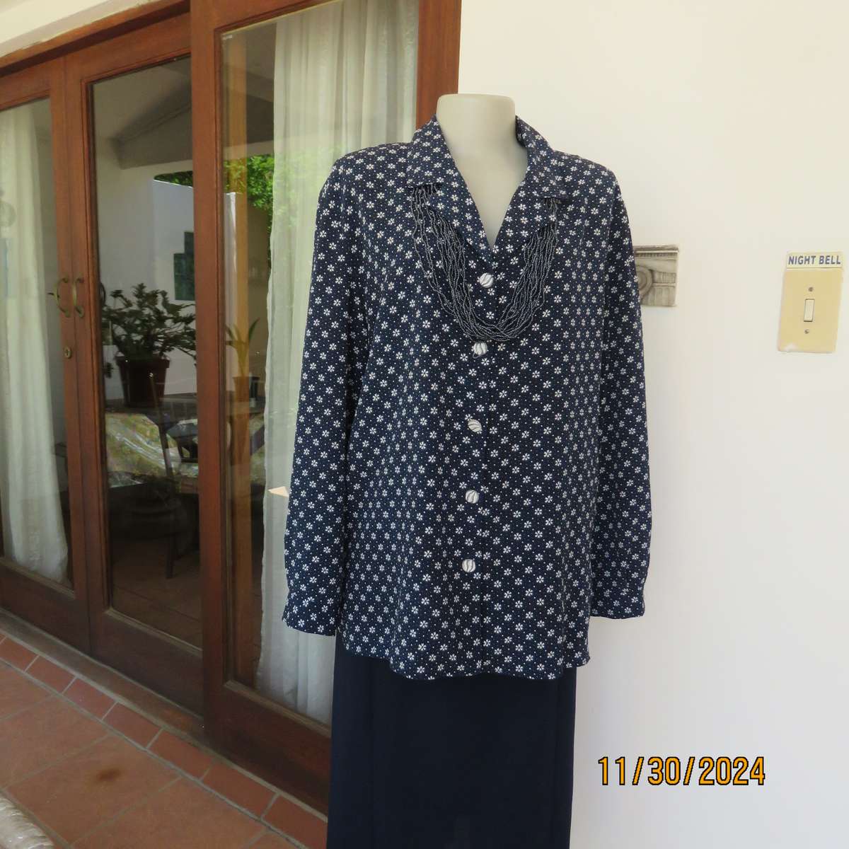 Classic navy long sleeve button down top with tiny white flowers.Size 42. Button down.As new