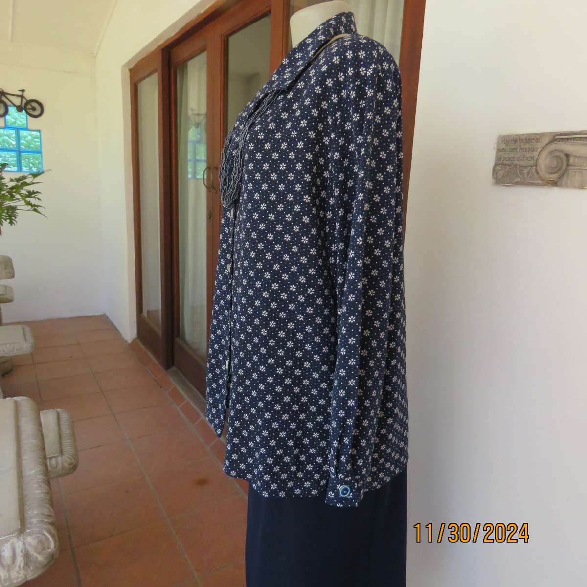 Classic navy long sleeve button down top with tiny white flowers.Size 42. Button down.As new