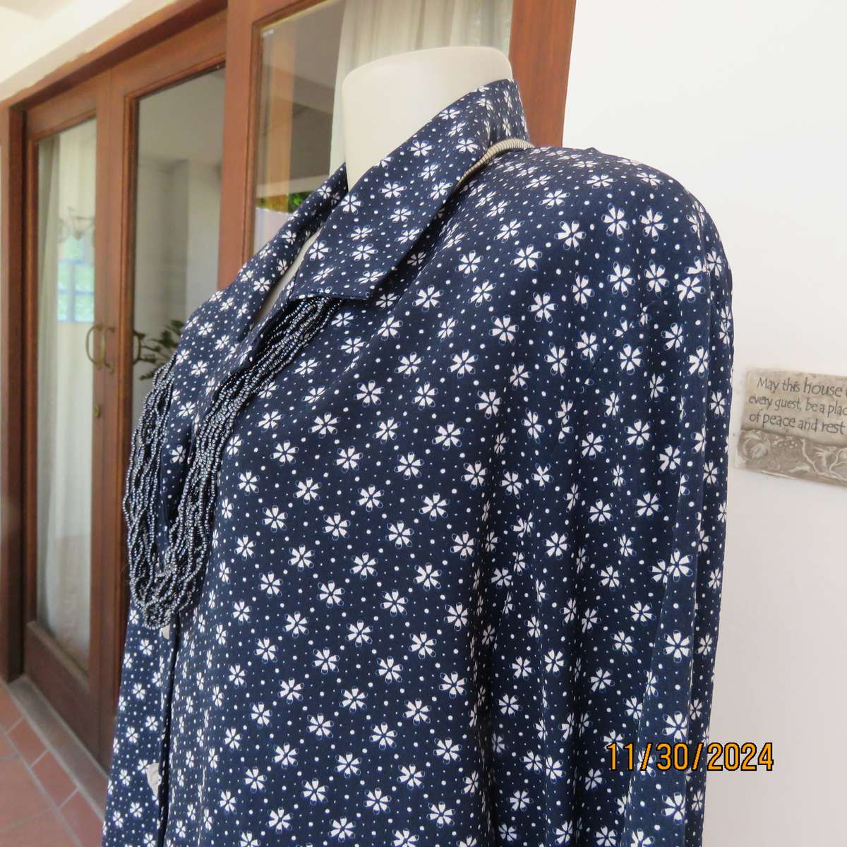 Classic navy long sleeve button down top with tiny white flowers.Size 42. Button down.As new