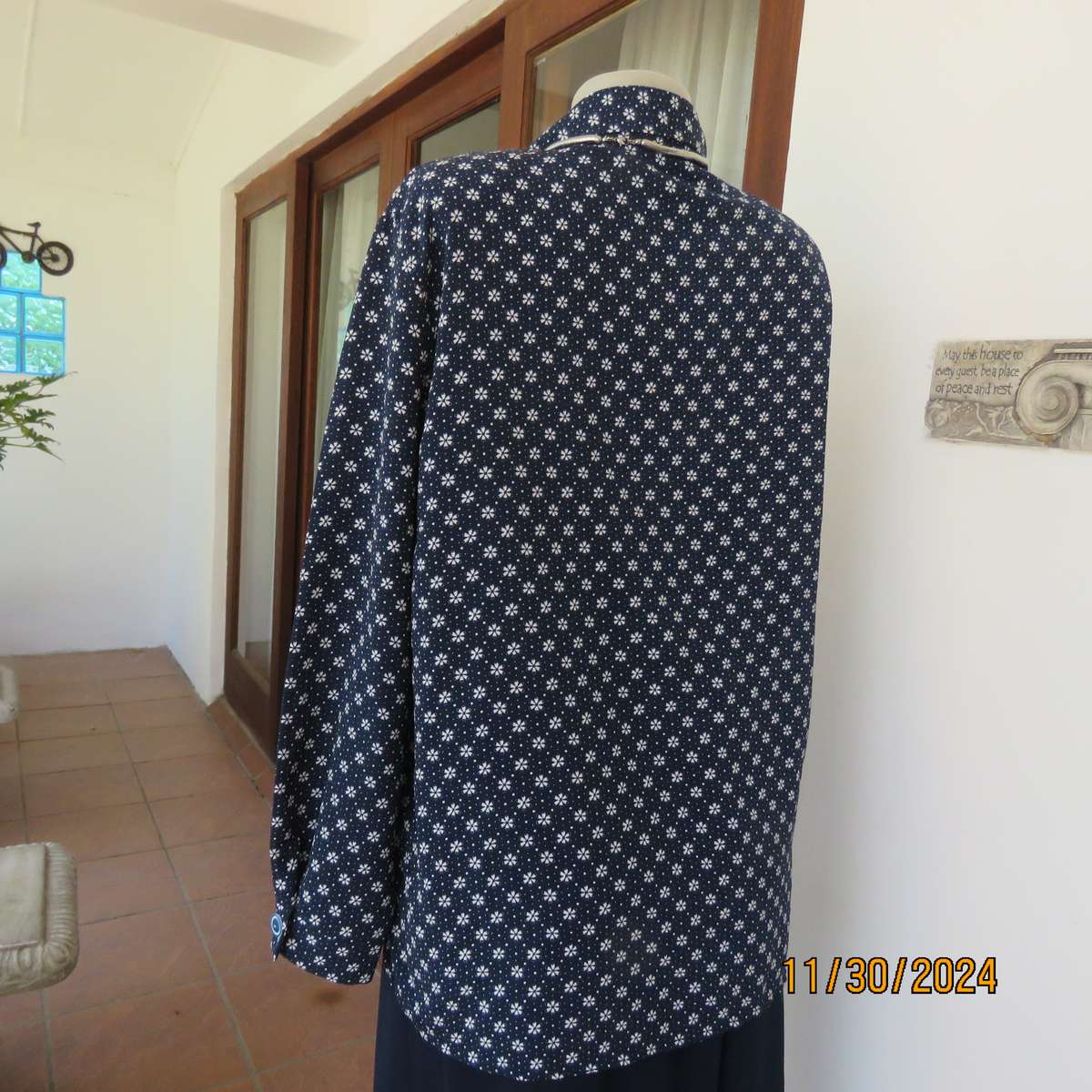 Classic navy long sleeve button down top with tiny white flowers.Size 42. Button down.As new