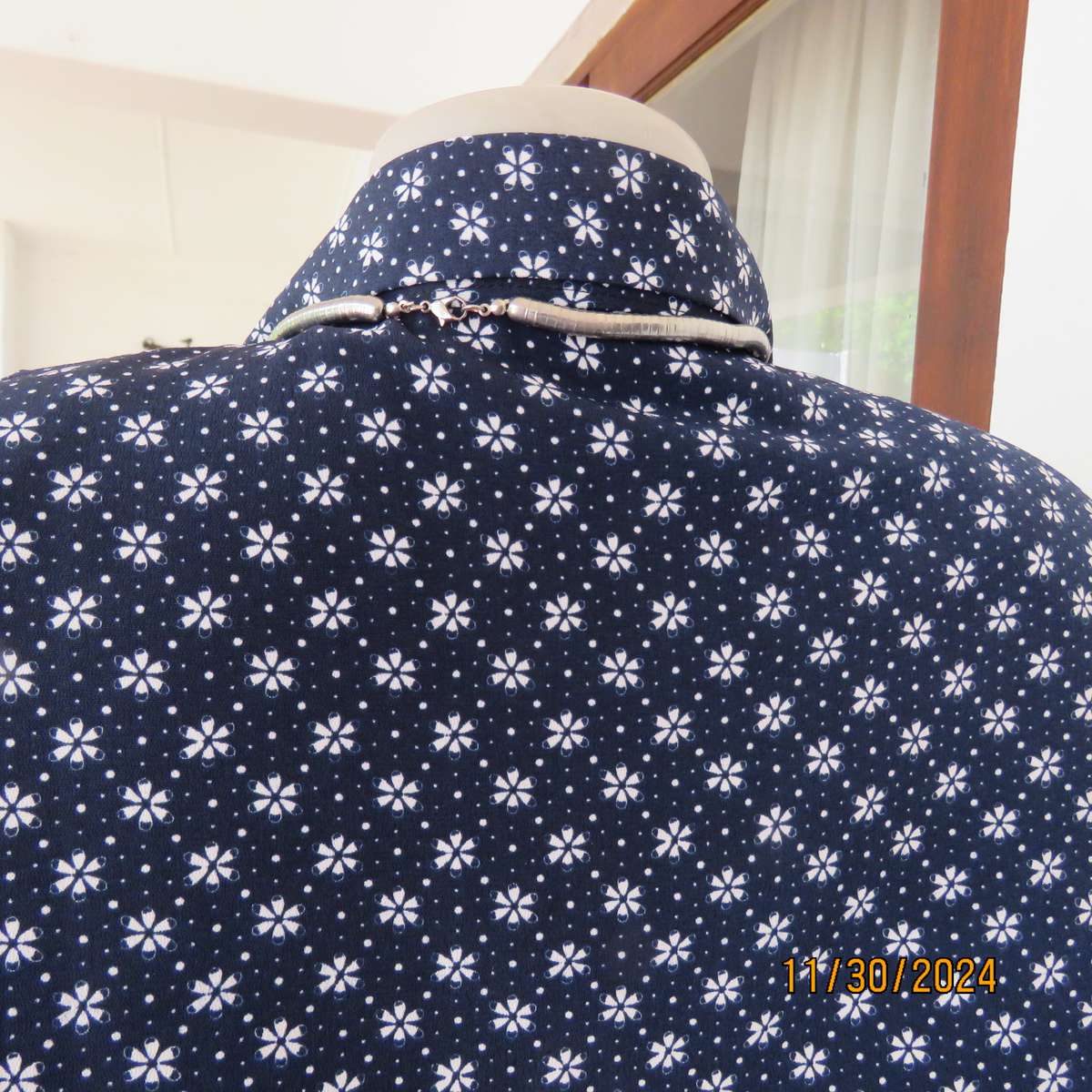 Classic navy long sleeve button down top with tiny white flowers.Size 42. Button down.As new