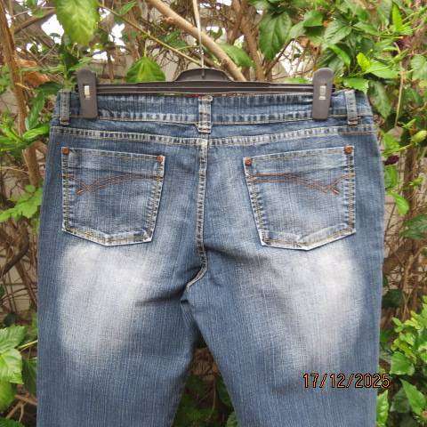 Straight legged blue denim polycotton stretch low rise jeans size 40. As new.