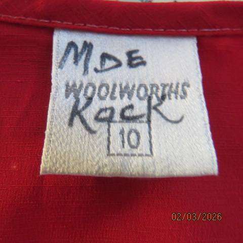 WOOLWORTHS bright red button down short sleeve top with front lace hem. Size 34