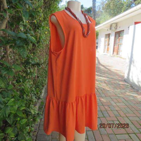 Orange sleeveless slip-over slightly creased polyester dress with frill bottom, size 44-46