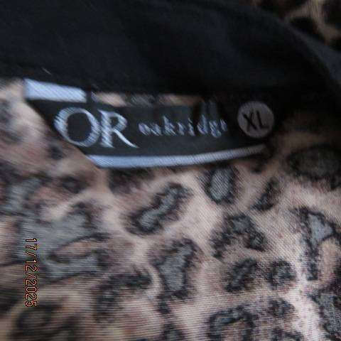 Animal print long sleeve brown-cream-black thin polycotton top. V neck with black edging. Size 44