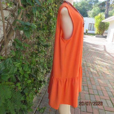 Orange sleeveless slip-over slightly creased polyester dress with frill bottom, size 44-46