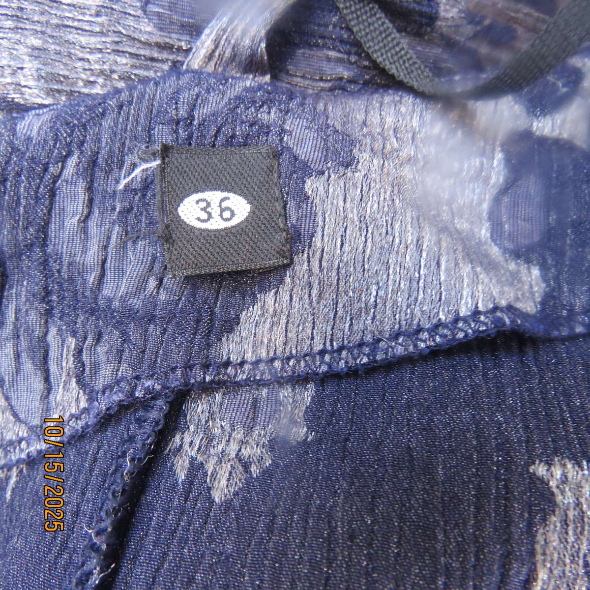 Silver vertical crinkled sleek nylon-rayon dress with navy embossed flowers. Size 36