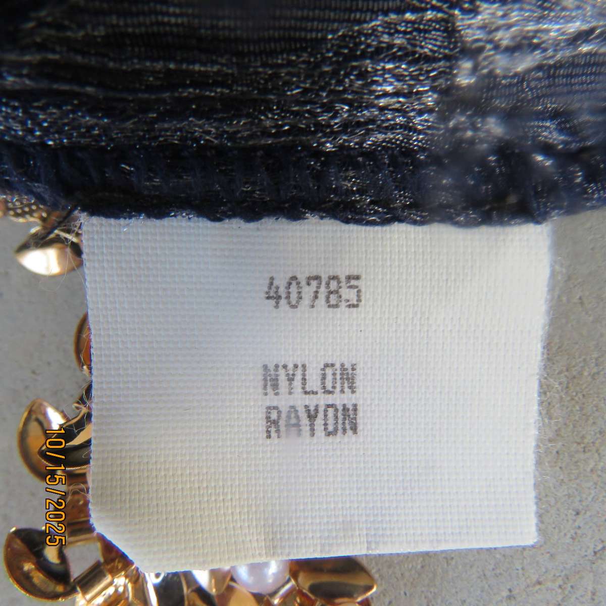 Silver vertical crinkled sleek nylon-rayon dress with navy embossed flowers. Size 36