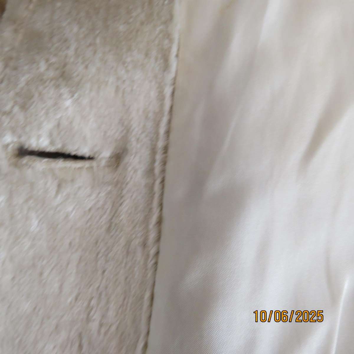 Rich cream faux fur 80's long raglan sleeve lined coat. Three button closure. Size 40