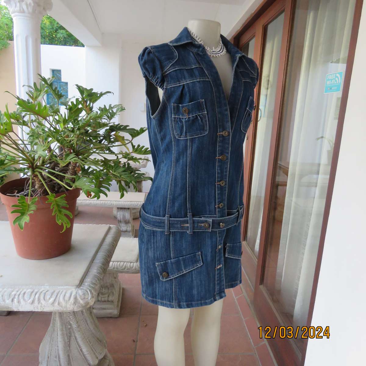 Trendy 100% cotton blue denim jean top-dress. Button down. Yoked. Capped sleeves.Belt.Size 36
