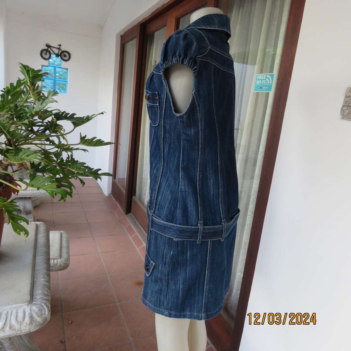 Trendy 100% cotton blue denim jean top-dress. Button down. Yoked. Capped sleeves.Belt.Size 36