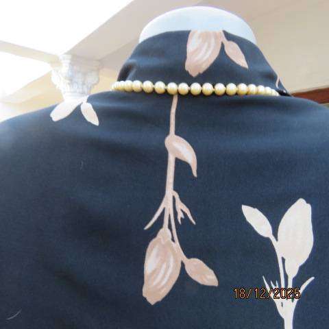 BODY RAP black polyester long sleeve button down top with single golden cream flowers. Size 38