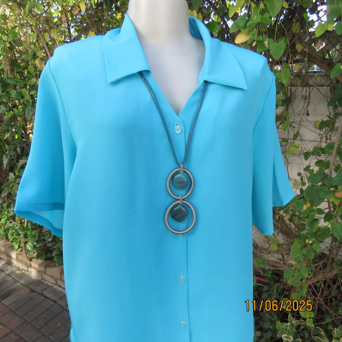TOGETHER light turquoise short sleeve silky polyester open v collar top. Size 40.