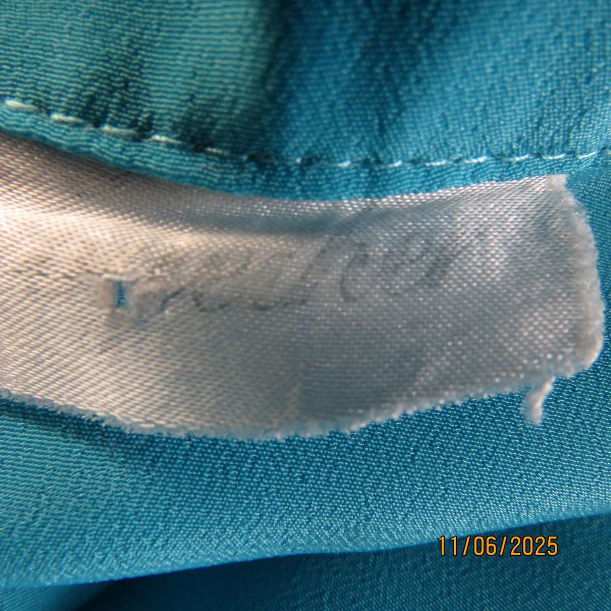 TOGETHER light turquoise short sleeve silky polyester open v collar top. Size 40.