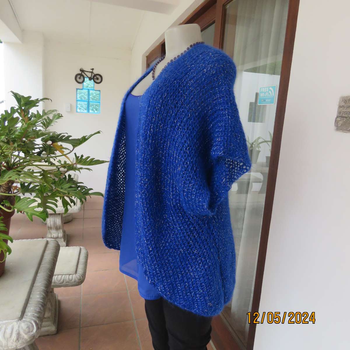 Glamorous azure blue with silver thread acrylic knitted cover-up. size 40-42. Handknitted.As new