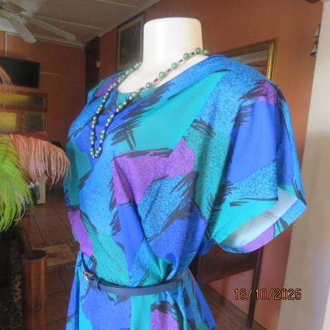 Violet-green-blue with black accents polyester slip over size 44-46 dress.