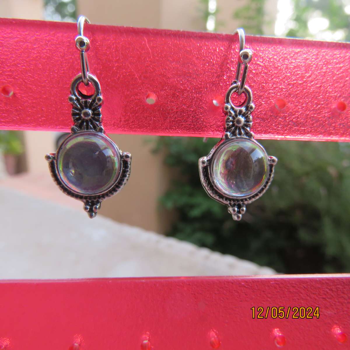 Cute silvery earrings with faux opal stones. Very pretty. New item