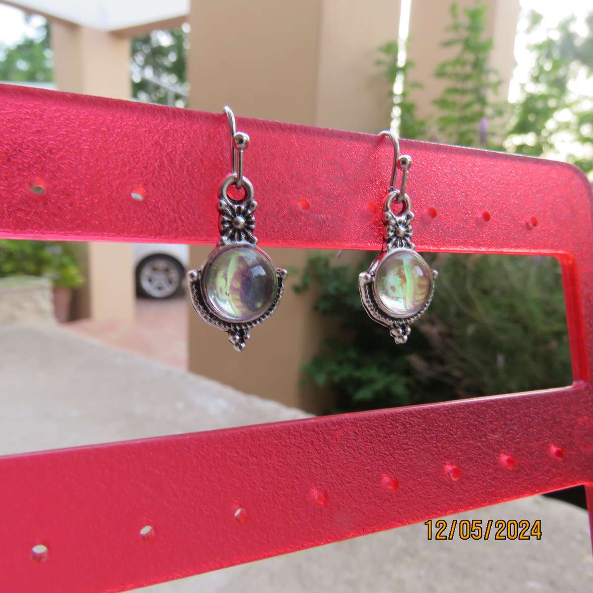Cute silvery earrings with faux opal stones. Very pretty. New item