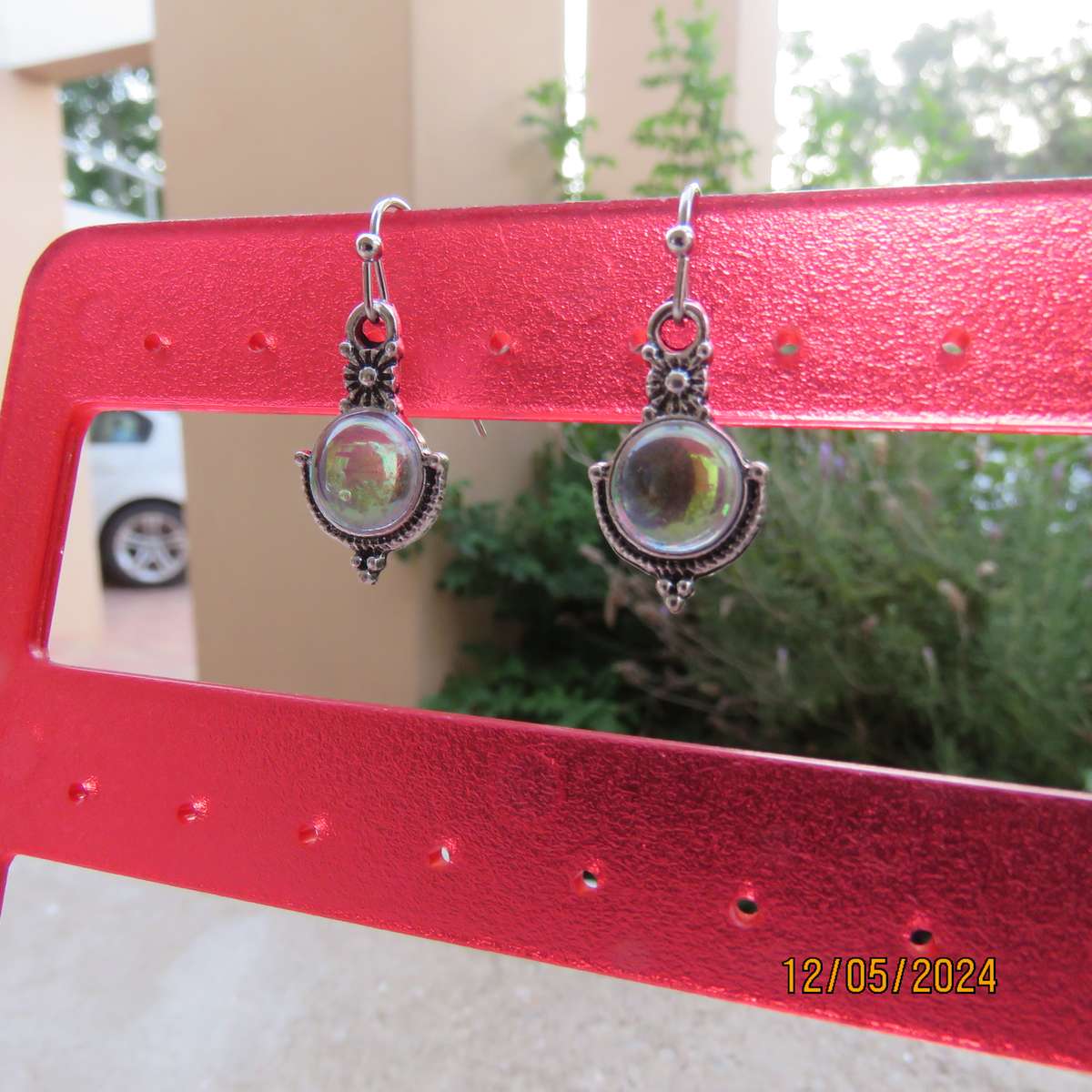 Cute silvery earrings with faux opal stones. Very pretty. New item