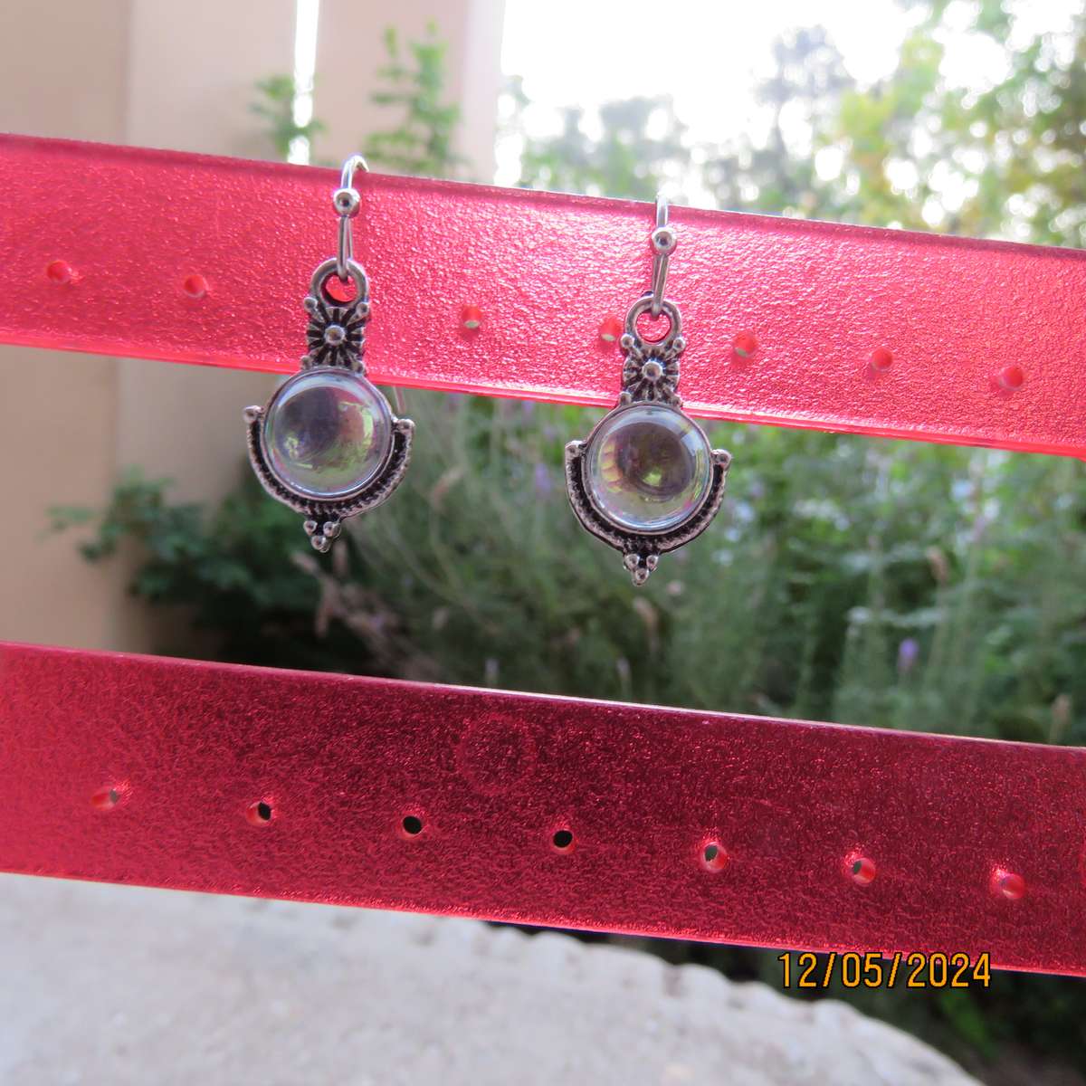 Cute silvery earrings with faux opal stones. Very pretty. New item