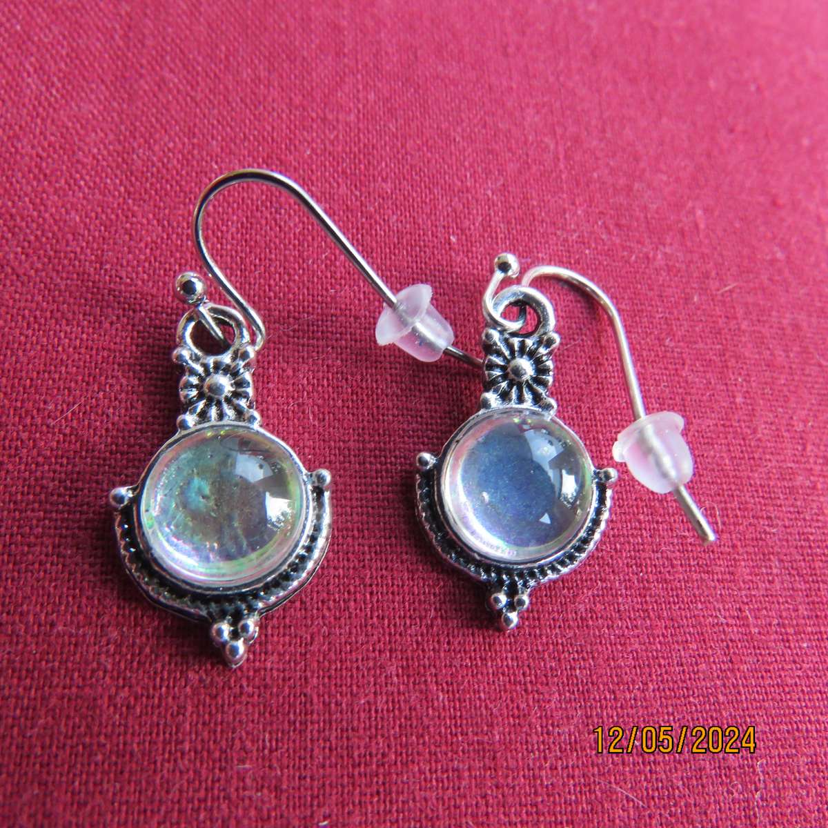 Cute silvery earrings with faux opal stones. Very pretty. New item