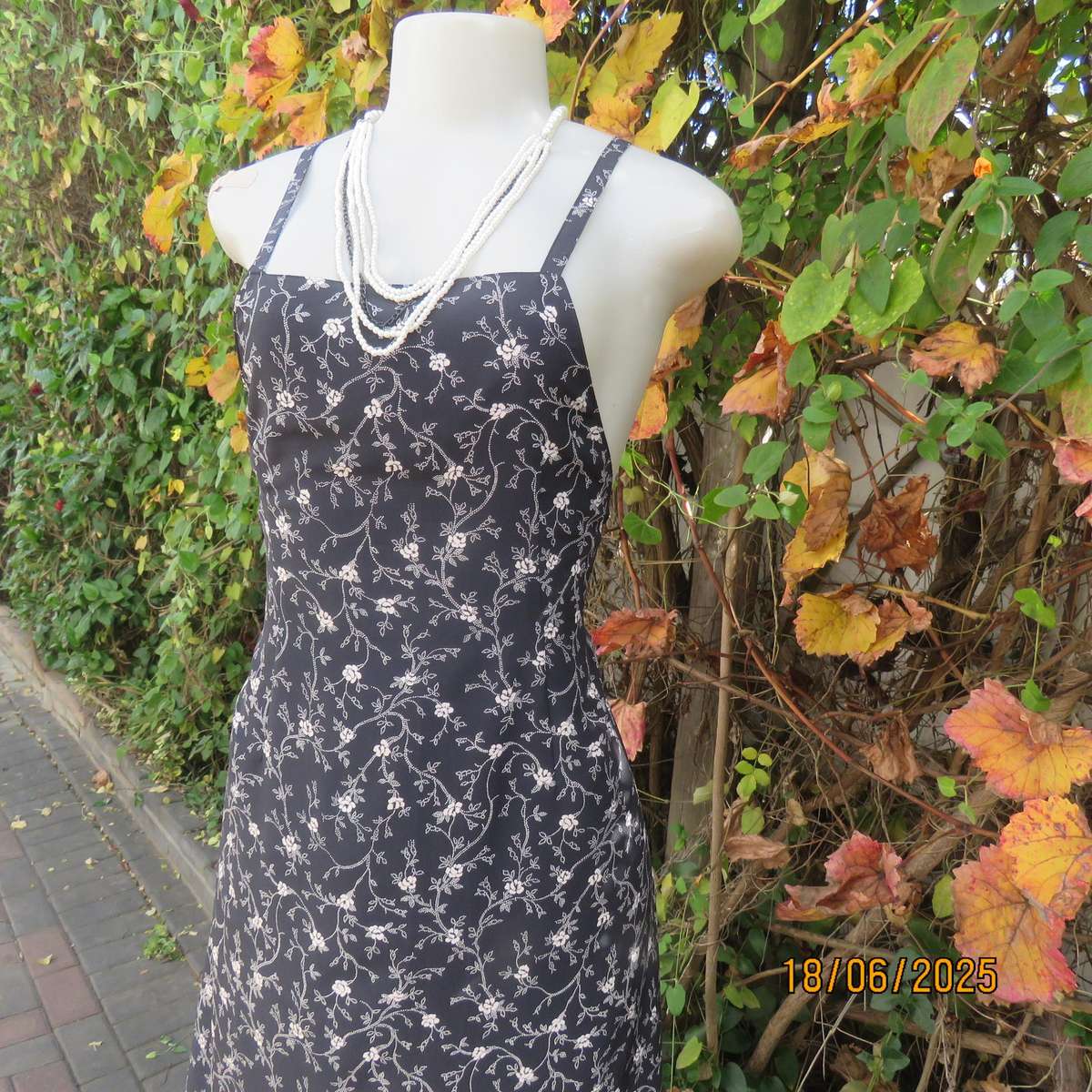 MADY black-white floral polyester low calf length dress. Bib front with straps. Size 34.