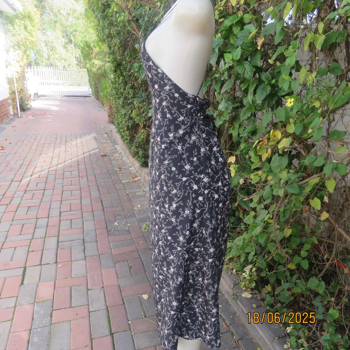 MADY black-white floral polyester low calf length dress. Bib front with straps. Size 34.